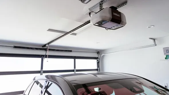 Garage door opener installed in a modern garage for convenience.