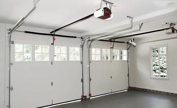 Home garage showing new garage door installation with two doors and windows.