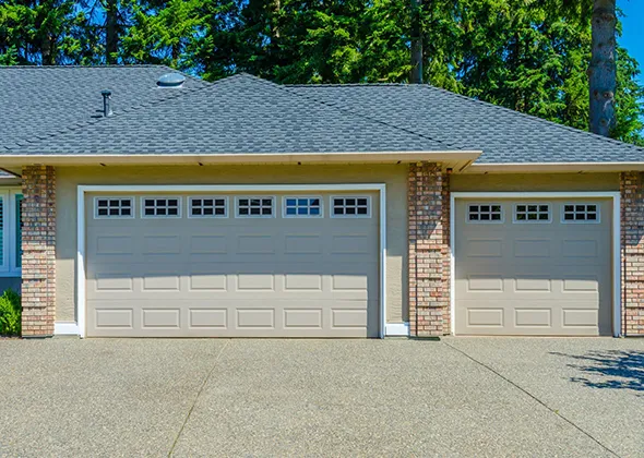 New garage door installation with a stylish design, making home look better and safer.